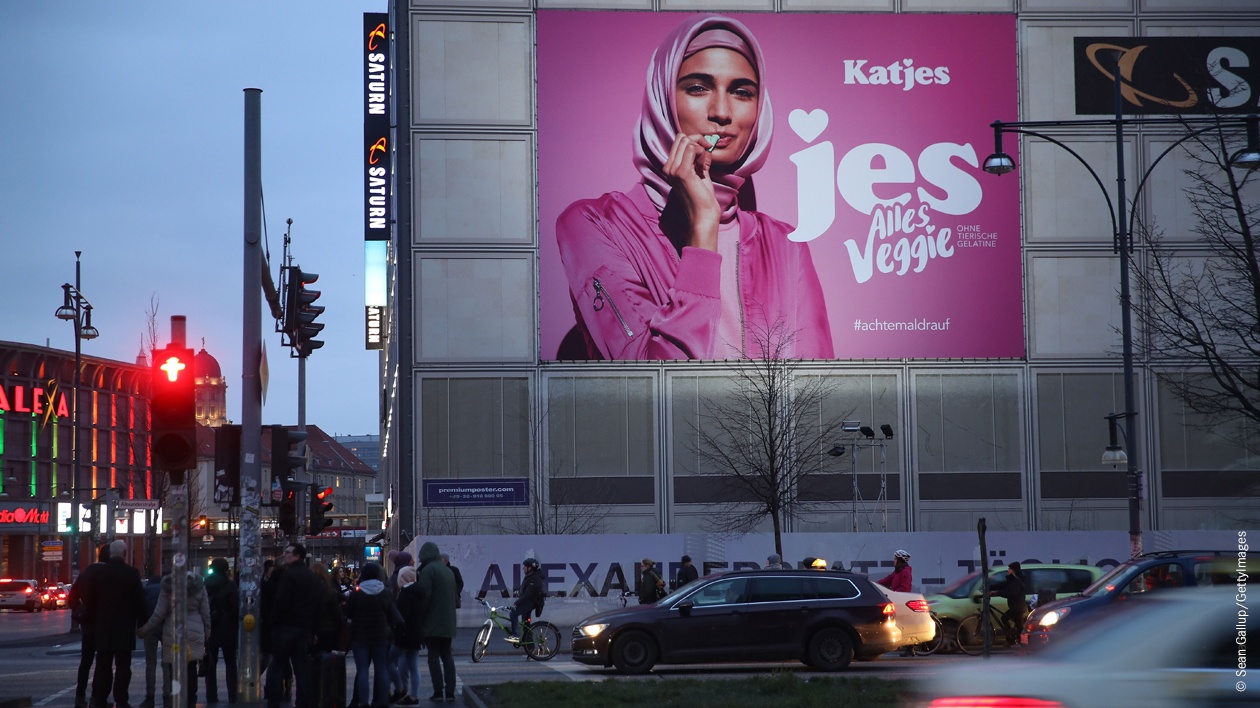 An advertisement for a new line of vegetarian sweets by German candymaker Katjes features a Muslim woman wearing a headscarf at Alexanderplatz on February 2, 2018 in Berlin, Germany.